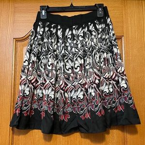 Black, white, and red print skirt. Size 4